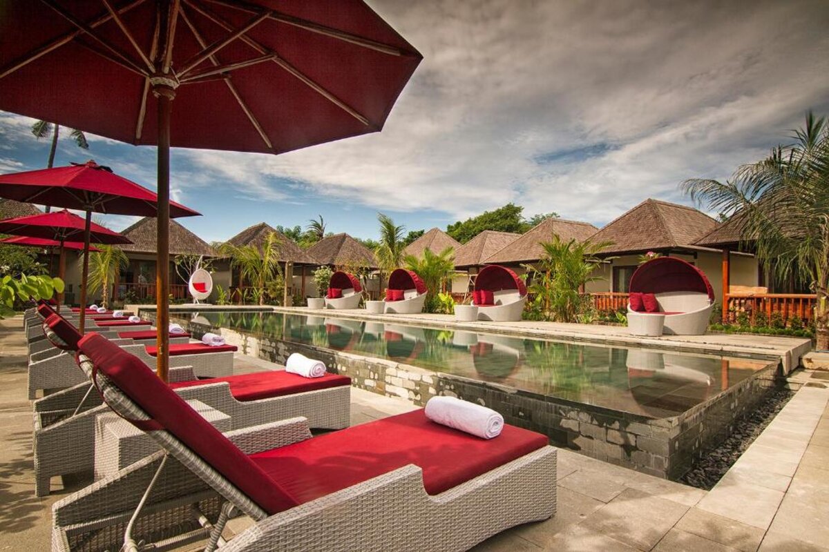 Red umbrellas along the pool deck